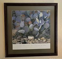 Front view of the framed poster showing the cactus and quail artwork with the dark wood frame and olive green matte.