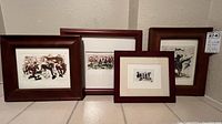 Four framed etchings arranged side by side showing overall condition and framing.