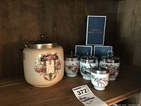 Photo showing all four Royal Worcester egg coddlers and lidded biscuit jar with boxes in background