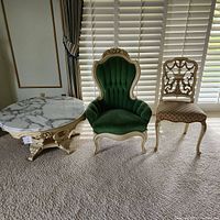 Overall view of armchair, side chair and marble top table placed side by side