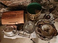 Overview of the lot showing copper items, silver trays, and various serving pieces