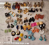 Overview of all twenty-nine pairs laid out on marble surface