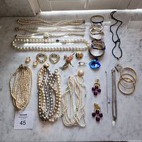 Overview of all jewelry items including necklaces, bracelets, earrings, brooches and ring