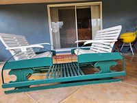 Front view of two-seated glider bench showing seating and frame