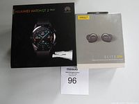 Huawei Watch GT 2 box beside Jabra Elite 85t box with lot number card