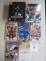 Seven sealed Nintendo Switch game cases laid out in two rows