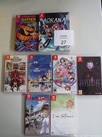 Eight Nintendo Switch game cases arranged in rows on a surface