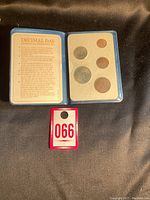 Blue coin holder showing a total of five British decimal coins and informational text about Decimal Day 1971