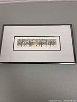 Framed limited edition artwork with visible white mat and thin black frame, showing the entire framed piece.