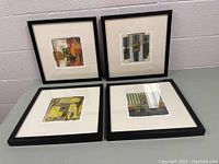 Four framed artworks laid out representing the elements Earth, Wind, Water, and Fire, showing textured paper and abstract designs.