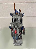 Front view of Optimus Prime Transformer figure, showing detailed sculpt and color scheme.