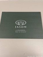 Front of placemat box showing Jason brand logo and text '4 Placements Make the Occasion'