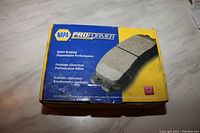 Photo of the unopened box of Napa Proformer front brake pads for 2006 Ford F150 showing the product label and packaging.