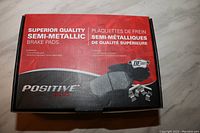 Top view of box showing brand, brake pad type and quality description.