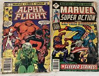 Photo showing two Marvel comic books laid side by side: Alpha Flight #2 and Marvel Super Action #1 featuring Captain America.