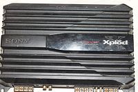 Top view of Sony Xplode 1000 Watt car amplifier showing heat sink and branding.