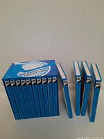 Blue slipcase box containing Hardy Boys books volumes 1 to 8, plus four additional individual books from the series.
