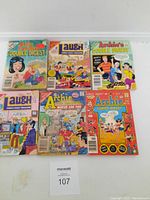 Photo showing six older Archie Comics including two Archie Double Digest, two Laugh Comics Digest, and two Archie Comics Digest copies on a white surface.