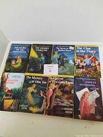 Front covers of six Nancy Drew books showing titles and cover art: The Secret of the Old Clock, The Hidden Staircase, The Secret of Shadow Ranch, The Clue in the Diary, The Mystery at Lilac Inn, The Secret of Red Gate Farm