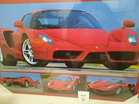 Full view of large red Porsche car print showing main image and three smaller inset images of the car in various angles.