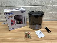 Photo showing the Freesea small betta fish tank, box, decorative plants, manual and USB cable