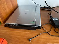 Canon Canoscan Lide 700F scanner showing front edge with function buttons and power connector cable.