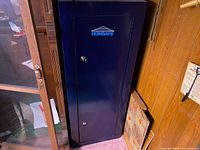 Front view of closed HomSafe cabinet showing brand logo