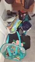 Various tote bags, reusable grocery bags stacked and some shoes visible in the background including white sneakers and brown boots.