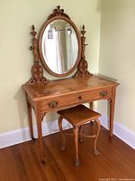 Full front view of vanity table and stool