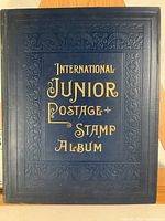 Front cover of album; dark blue embossed with gilt lettering