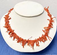 Front view of the coral bead choker on display, showing the textured natural coral beads.