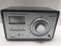 Front view of the black SANYO R227 Internet/FM Radio and Media Player showing LCD screen, control dial, and buttons