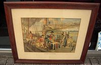 View of the framed art print showing the oak frame, aged matte, and historic scene of figures on a ship deck titled "The Toronto Purchase 1788".