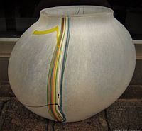 Front view of the inside with colorful vertical stripes and matte frosted glass surface.