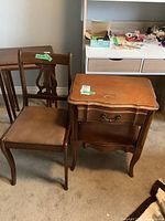 Front view of harp-back wooden chair with padded seat and wooden nightstand showing drawer and shelf.