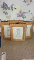 Four pieces of framed wall art by Peggy Abrams, each measuring 11x9 inches, showing illustrations of dresses on hangers.