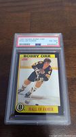 Front view of 1991 Score Bobby Orr Hall of Famer hockey card graded PSA 6, showing the image of Bobby Orr in Boston Bruins uniform, PSA slab and grading label.