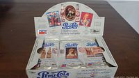 Photo showing a partially open box of Pepsi Cola trading card packs from The Collector's Series with various vintage-themed packs visible