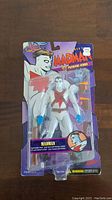 Front view of Madman action figure in blister packaging on a purple and orange card labeled '1998 Premiere Series'