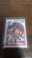 Front view of 1989 NBA All-Star Michael Jordan basketball card showing player image and event details.