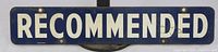 Front side of enamelled metal sign with white 'RECOMMENDED' lettering on dark blue background, shows minimal wear and rust around mounting holes.