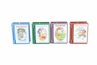 Four Winnie The Pooh themed book-style Christmas ornaments shown closed, with colorful illustrated covers depicting different scenes from the Winnie The Pooh stories.