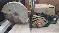 Front side view of entire saw including blade and housing