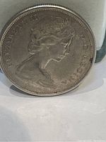 Obverse side of the coin showing Queen Elizabeth II profile with inscriptions.
