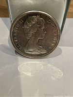 Close-up of obverse side showing Queen Elizabeth II portrait with inscriptions.