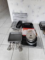 Overview of all baking items including baking pans, cooling racks, marble board, and scoops.