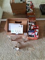 Image showing the full lot including the light fixture, box, and multiple LED bulb boxes on carpet.