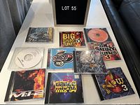 Top view of 10 music compilation CDs showing titles and case artwork for identification and condition details.