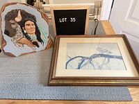 Overall view of the snowy owl print and painted warrior mold together with lot sign