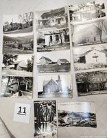 Photo showing fourteen black and white vintage postcards depicting various historic rural and small town buildings including mills, churches, stores, farmhouses and flood damage.
